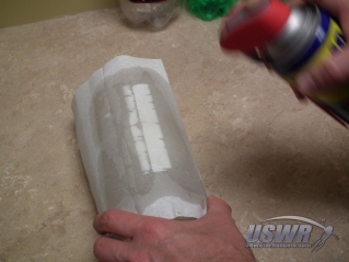 Soak paper towel with WD-40.